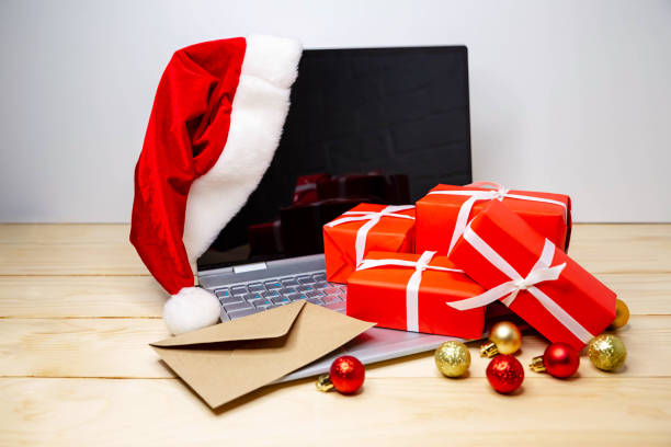 istock Christmas online shopping. Human doing the order on laptop computer 1288842270