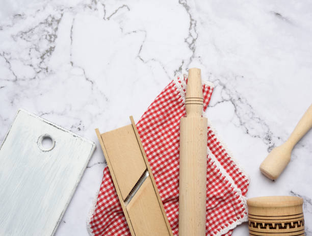 istock wooden kitchen utensils on white marble table 1288843900