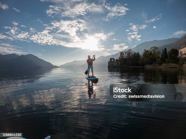First Person Point Of View Of A Woman Paddling On A Stand Up Paddle Board Stock Photo - Download Image Now