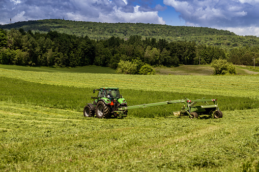 agriculture tractor machinery harvesting hay field