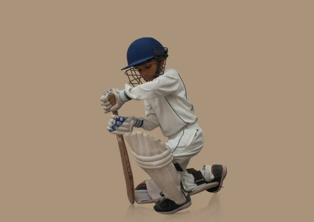 istock A boy in cricket uniform playing Cricket 1288847472