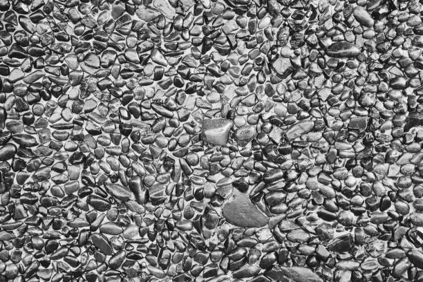 Very old gray natural stone wall background texture