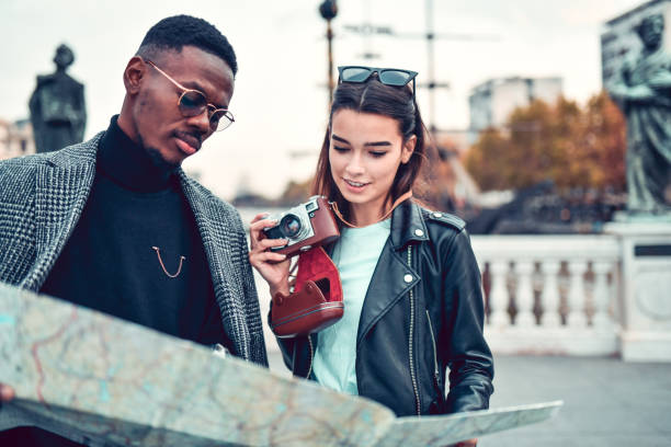 istock Mixed Couple Exploring City Center With Map And Taking Photos 1288850213