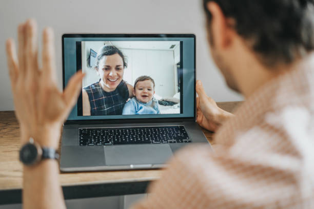istock Father talking to wife and baby on the computer 1288850276