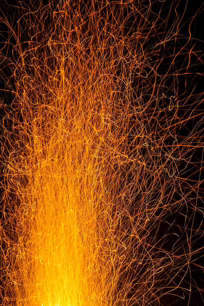 istock Sparks from a fire against dark night. Bonfire 1288851110
