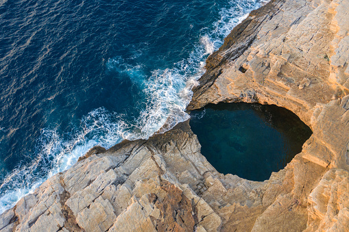 Aerial drone view of Giola lagoon, a natural seaside pool in Thassos, Greece
