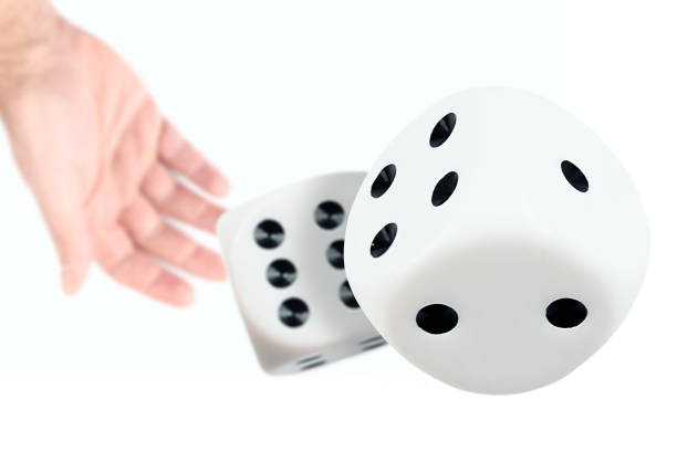 istock person throwing or rolling dice against white background 1288851685