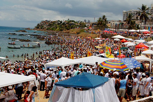 salvador, bahia / brazil - february 2, 2013: supporters of candomble are seen on the Rio Vermelho beach in the city of Salvador during a party in honor of Yemanja.
