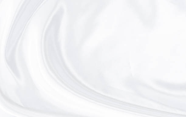 istock White gray satin texture that is white silver fabric silk background with beautiful soft blur pattern natural. 1288852797