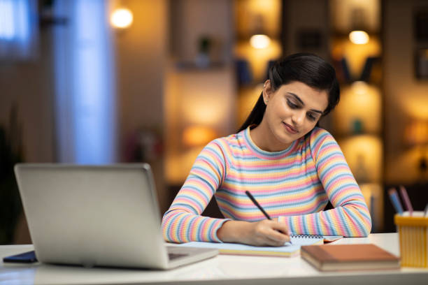 istock woman studying at home 1288856587