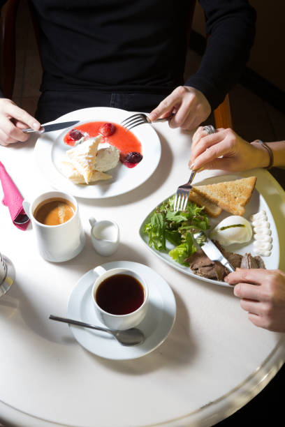 istock People eating breakfast in a cafe 1288861929