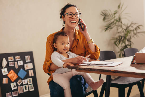 istock Working mom handling her business from home 1288863694