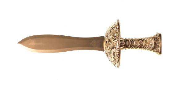 istock golden sword isolated on white background 1288864787