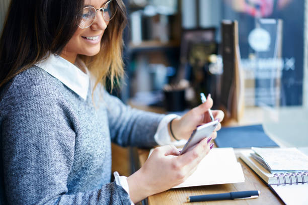 istock Happy female surfing smartphone in cafe 1288871794