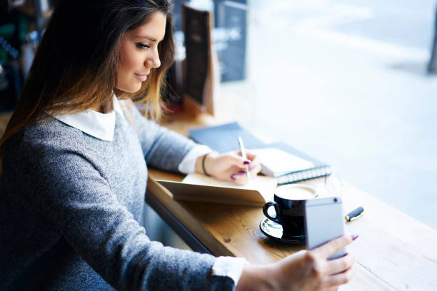 istock Reliable female manager making plan for day in copybook 1288871841