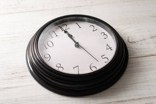 istock Clock on a white background. A minute to twelve. 1288874141