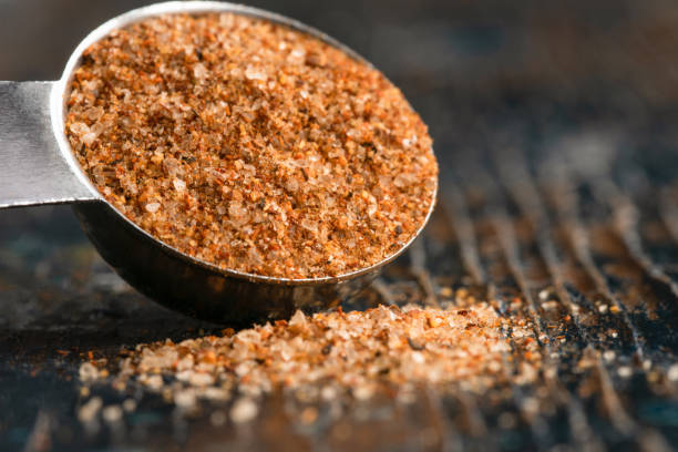 Cajun Seasoning Spilled from a Teaspoon Cajun Seasoning Spilled from a Teaspoon cajun food photos stock pictures, royalty-free photos & images
