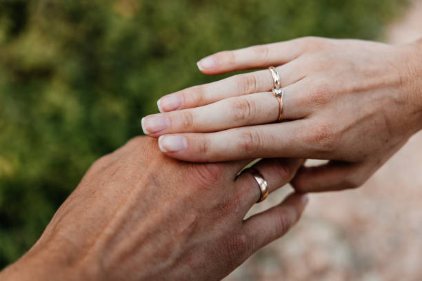 istock Hands of newlyweds with rings 1288878502