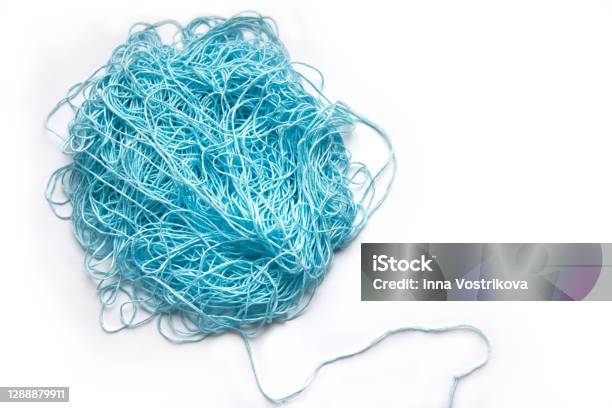 The Concept Of Brainstorming A Tangle Of Mint Blue Cotton Threads Needlework Yarn On A White Background Stock Photo - Download Image Now