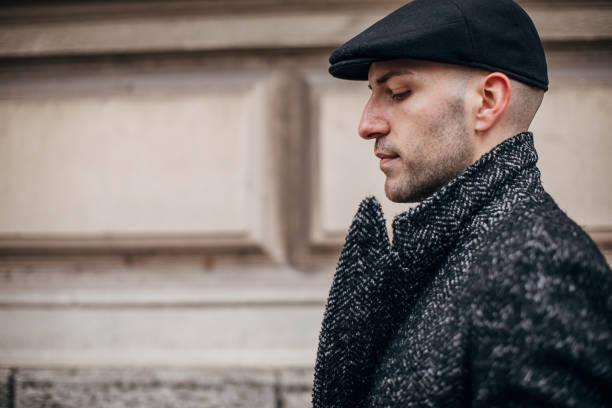 istock Side portrait of young man outdoors in the city 1288881237