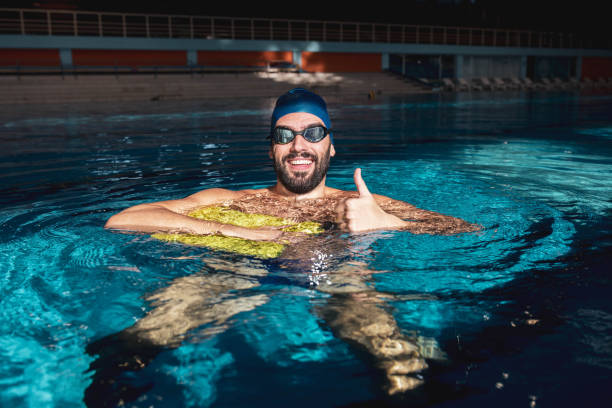 istock The handsome man in the pool feels great 1288882518