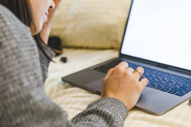 istock woman working on laptop close up 1288885260