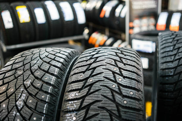 istock closeup of the tread of two different studded winter tires 1288886607