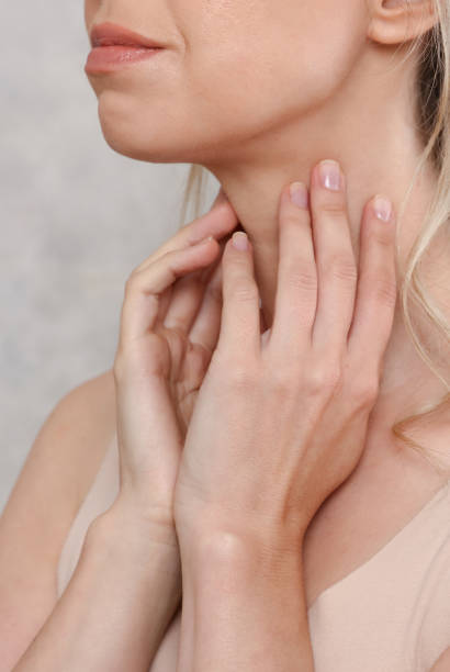istock Female neck close up. Preventive Woman thyroid gland control. 1288887452