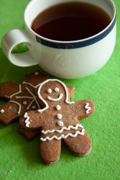 Coffee with Gingerbread ,star, tree, snow shaped cookies on grunge wooden table.