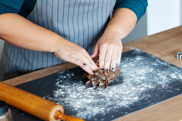 istock Young woman making Christmas cookies 1288889429