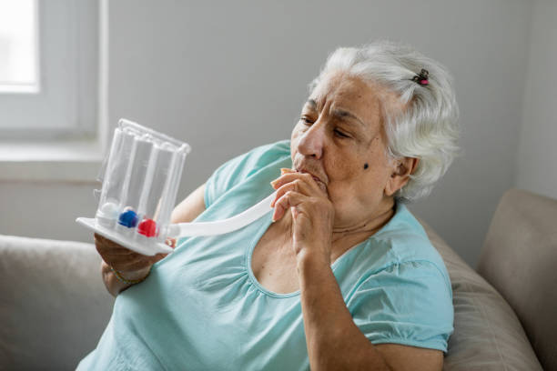 istock Old woman with breathing problems at home 1288889982