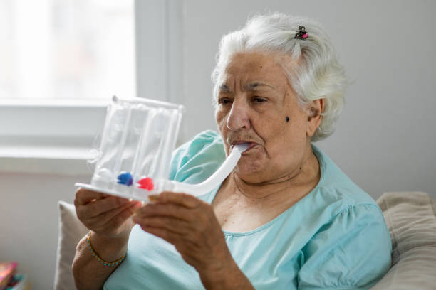 istock Old woman with breathing problems at home 1288890838