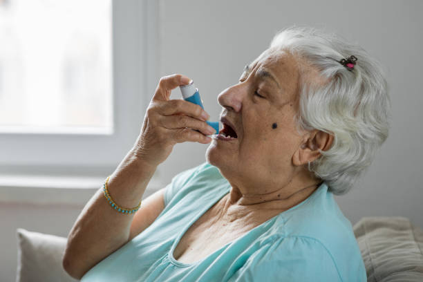 istock Senior woman with respiratory system problems 1288891001