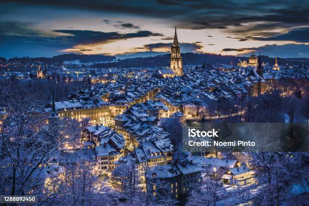 Winter Evening Sunset With Snowy And Illuminated Buildings Rosengarten Bern Unesco Switzerland Stock Photo - Download Image Now