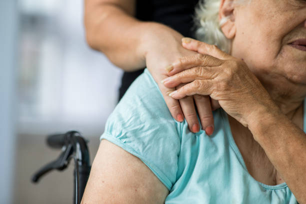 istock Caregiver with a senior woman 1288893792