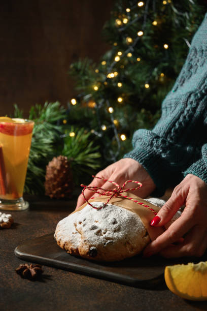 istock Traditional Christmas stollen decorated evergreen branches. 1288894773