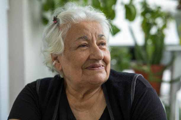 istock Smiling senior woman looking away 1288894857
