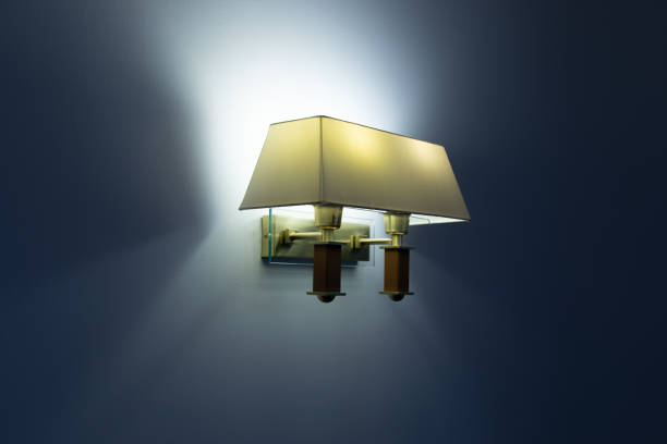 istock Wall lamp with yellow shade 1288900783