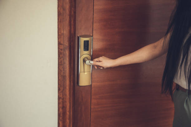 istock young woman opening hotel room 1288900785
