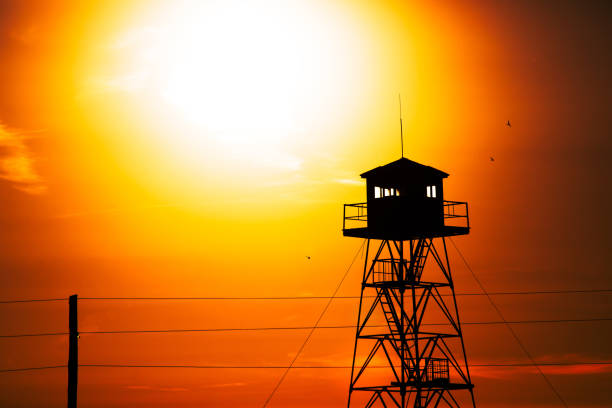 fire lookout tower at the sunset background