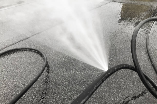 istock Punctured hose and high-pressure water leak, Hose 1288907221