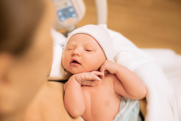 istock Newborn baby with her mother 1288911333
