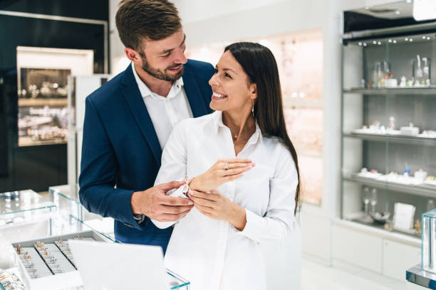 istock Attractive middle age couple at jewelry store 1288911601