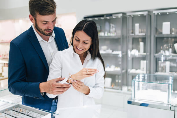 istock Attractive middle age couple at jewelry store 1288911621