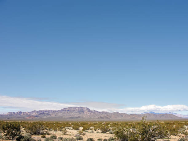 istock Distant mountain along a desert road in Arizona 1288912616