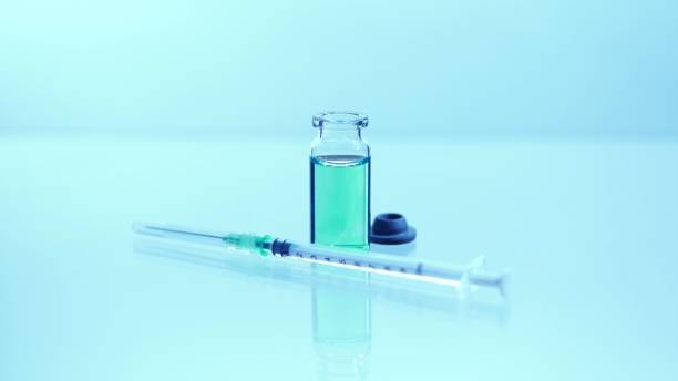vaccine vial with sterile needle syringe. concept of medical research development and production of vaccine against coronavirus, covid 19. drugs and medications for pharmaceutical industry. - syringe vaccination vial insulin imagens e fotografias de stock