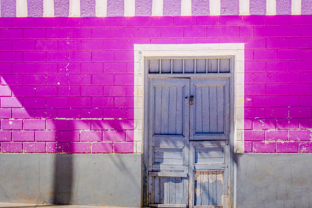 Old rustic door and stucco facade in Huaraz – Ancash province, Peru
