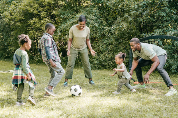 istock Family playing soccer 1288919376
