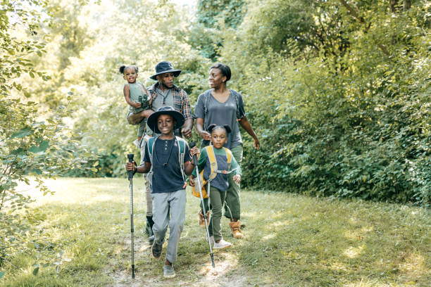 istock Parents and kids hiking together 1288919405