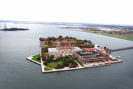 Ellis Island, New York City, United States, Island in the Hudson River, Upper New York Bay, Ellis Island Museum of Immigration, History of Immigration to the United States, Part of the Statue of Liberty National Monument, Statue of Liberty on Liberty Island, left in Background, Attraction, Point of Interest